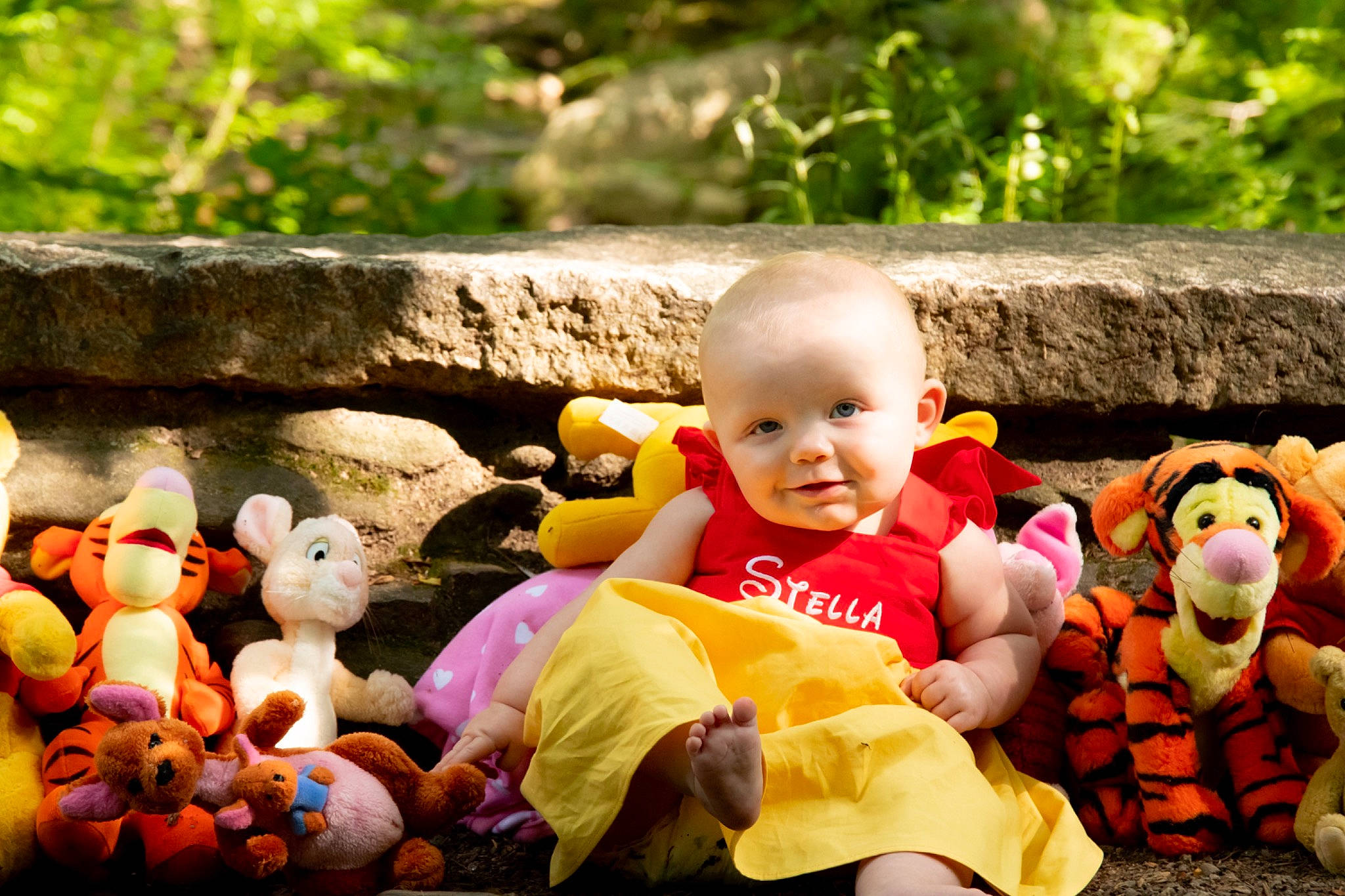 Stella James joined the competition — help win amazing prizes! baby, child, doll, fun, garden, grass, happy, lawn_ornament, leisure, natural_foods, people_in_nature, person, plant, recreation, sitting, stuffed_toy, teddy_bear, toddler, toy, tree