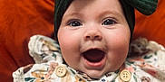 Dakota is registered to the contest to win money with this photo: accessories, animal, baby, babylaughing, bird, blouse, bodypart, bonnet, cap, clothing, costume, dress, face, fashion, formalwear, gown, happy, hat, head, headband
