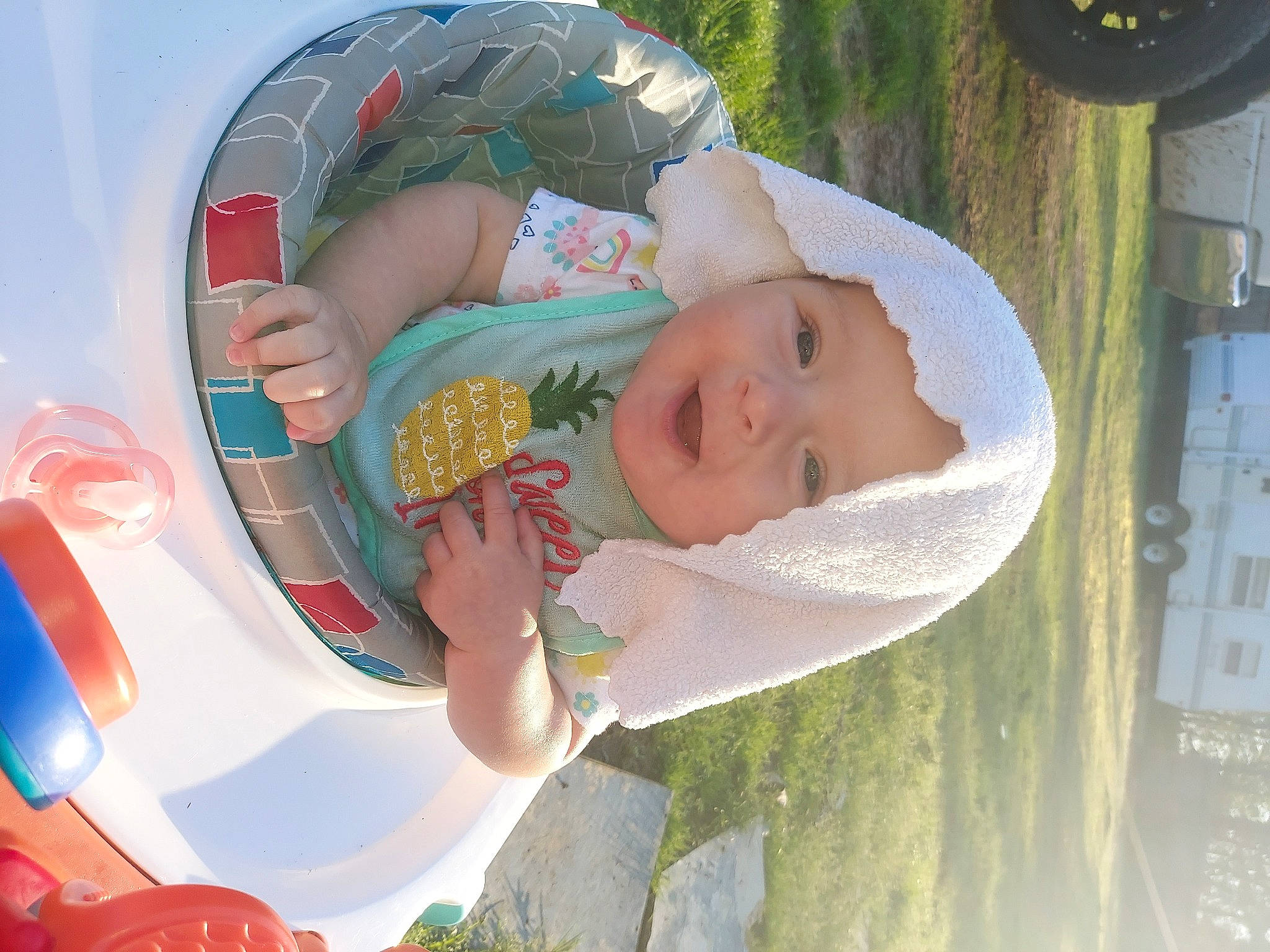 Harlyn is registered to the contest to win money with this photo: baby, baby_products, baby_toddler_clothing, child, circle, fun, grass, happy, hat, headwear, leisure, person, plant, play, recreation, smile, summer, toddler, vacation, water