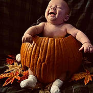 Takoda joined the competition — help win amazing prizes! baby, pumpkin, fall, autumn_leaves, smiling, cute, infant, sock, holiday, seasonal, happy, celebration, child, orange, nature, fun, cozy, cute_expression, festive, warm