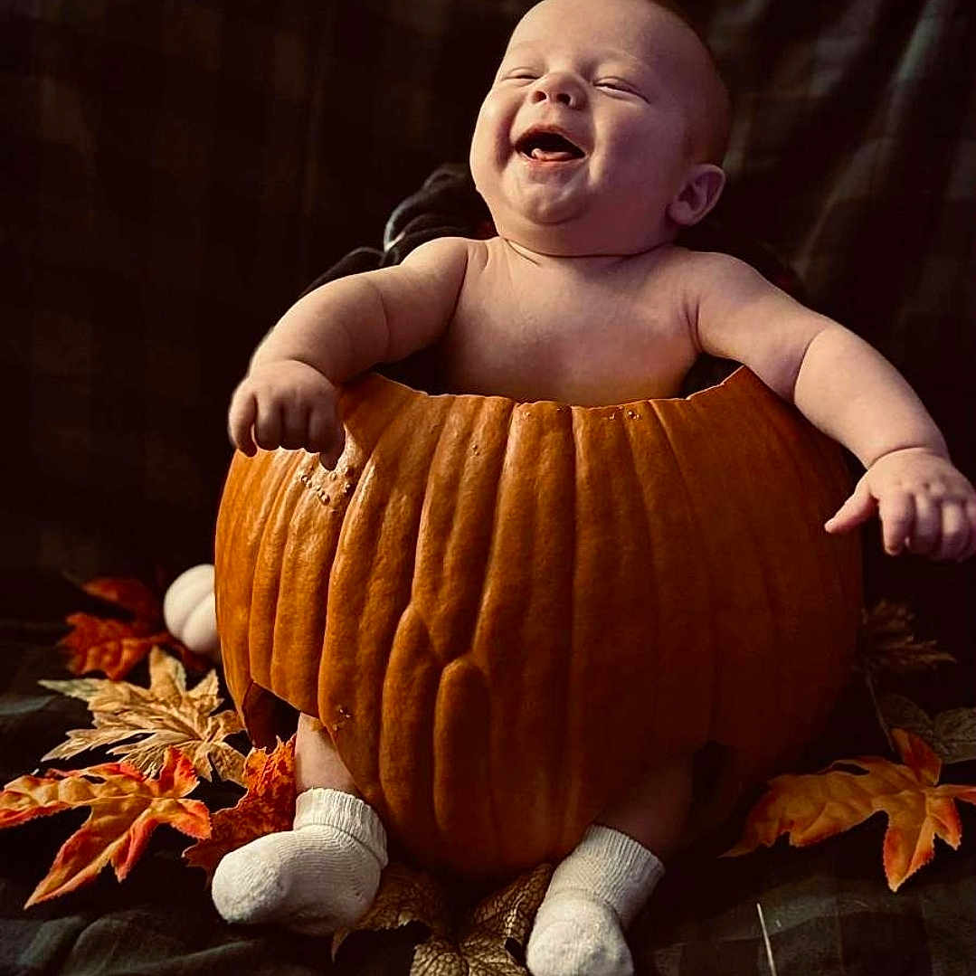 Takoda joined the competition — help win amazing prizes! autumn_leaves, baby, celebration, child, cozy, cute, cute_expression, fall, festive, fun, happy, holiday, infant, nature, orange, pumpkin, seasonal, smiling, sock, warm