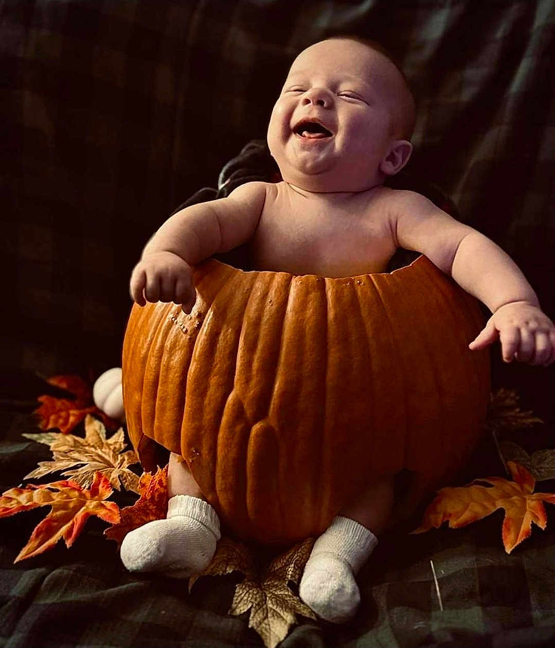 Takoda joined the competition — help win amazing prizes! baby, pumpkin, fall, autumn_leaves, smiling, cute, infant, sock, holiday, seasonal, happy, celebration, child, orange, nature, fun, cozy, cute_expression, festive, warm