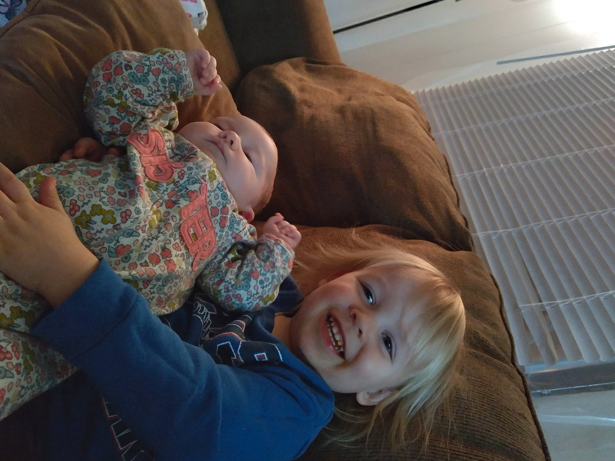 Liam is registered to the contest to win money with this photo: child, comfort, couch, fun, gesture, happy, joy, laugh, leisure, linens, nap, person, room, sitting, skin, sleep, smile, toddler, vacation