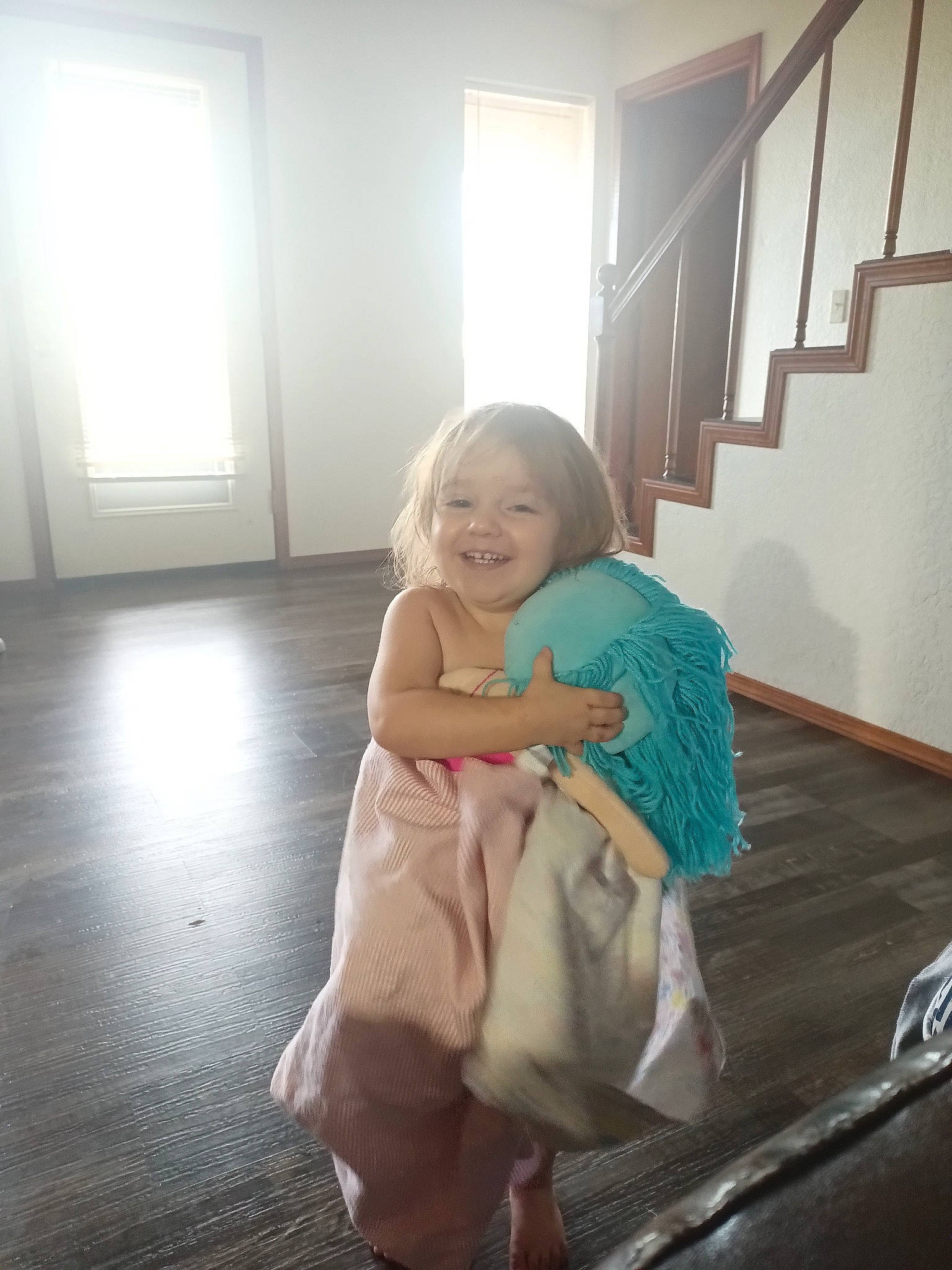 Hermione joined the competition — help win amazing prizes! baby, baby_toddler_clothing, comfort, door, dress, floor, flooring, fun, happy, hardwood, joy, leg, person, room, shoulder, sitting, smile, stairs, standing, toddler