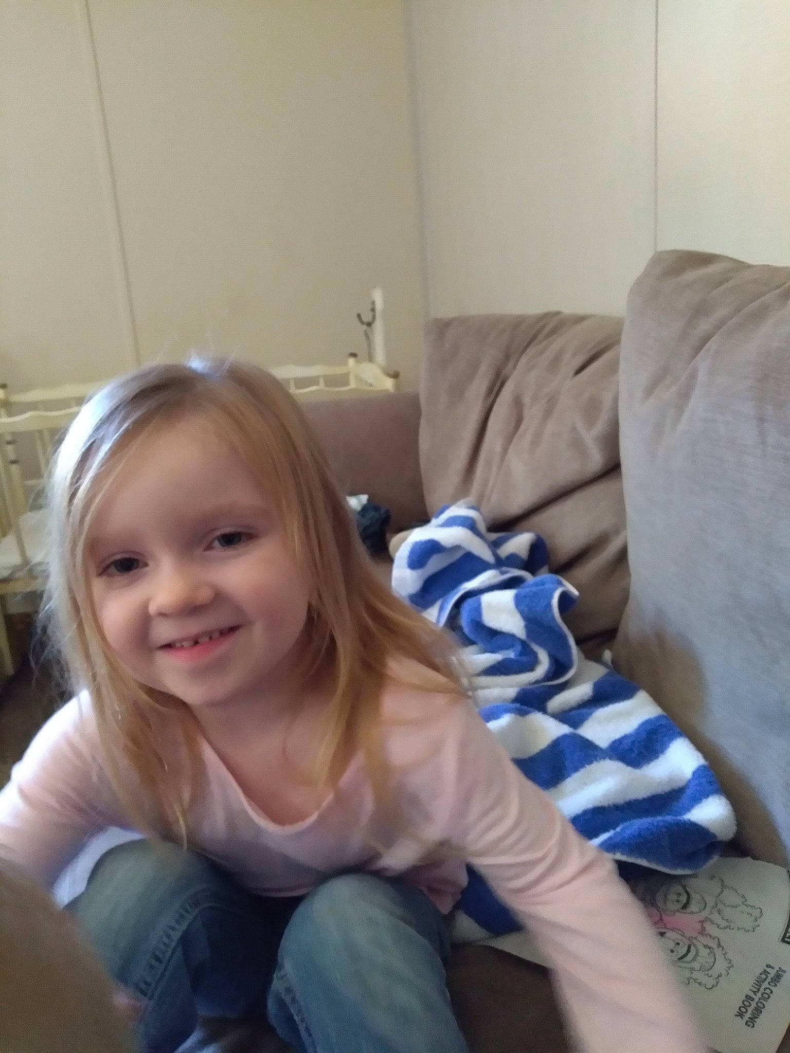 Paizley joined the competition — help win amazing prizes! comfort, couch, electric_blue, face, finger, flooring, happy, human_leg, jeans, joy, knee, lap, leg, linens, living_room, person, room, sitting, smile, t_shirt