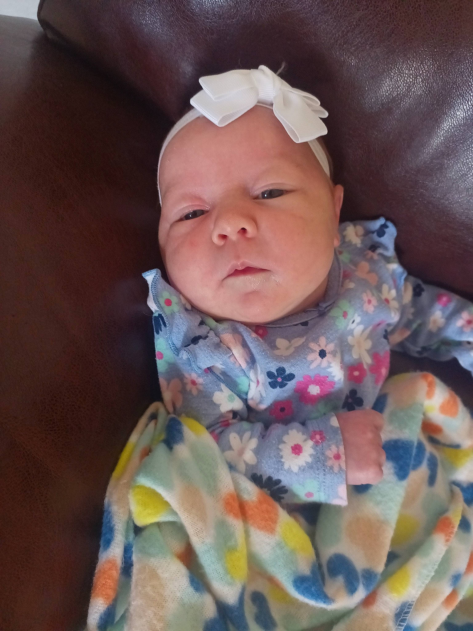 Penelope is registered to the contest to win money with this photo: baby, baby_products, baby_toddler_clothing, bib, cheek, child, collar, comfort, face, fashion_accessory, linens, lip, pattern, person, portrait_photography, sitting, skin, sleeve, toddler