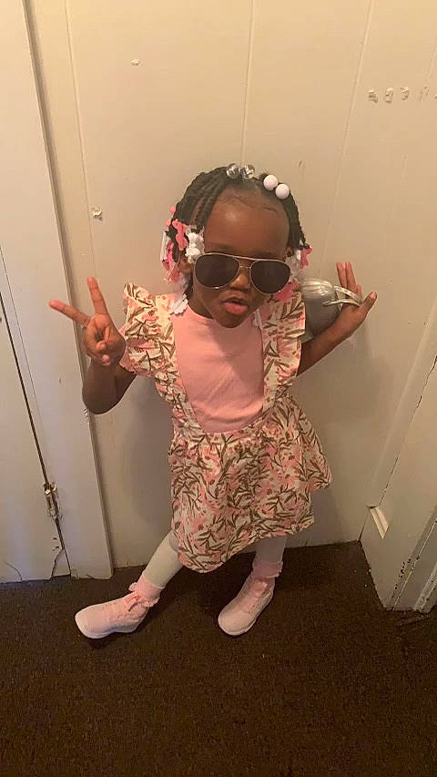 Janilya joined the competition — help win amazing prizes! baby_toddler_clothing, eye, eyewear, fashion_accessory, flooring, foot, fun, gesture, glasses, goggles, happy, human_leg, neck, pattern, person, personal_protective_equipment, sleeve, sunglasses, thumb, toddler