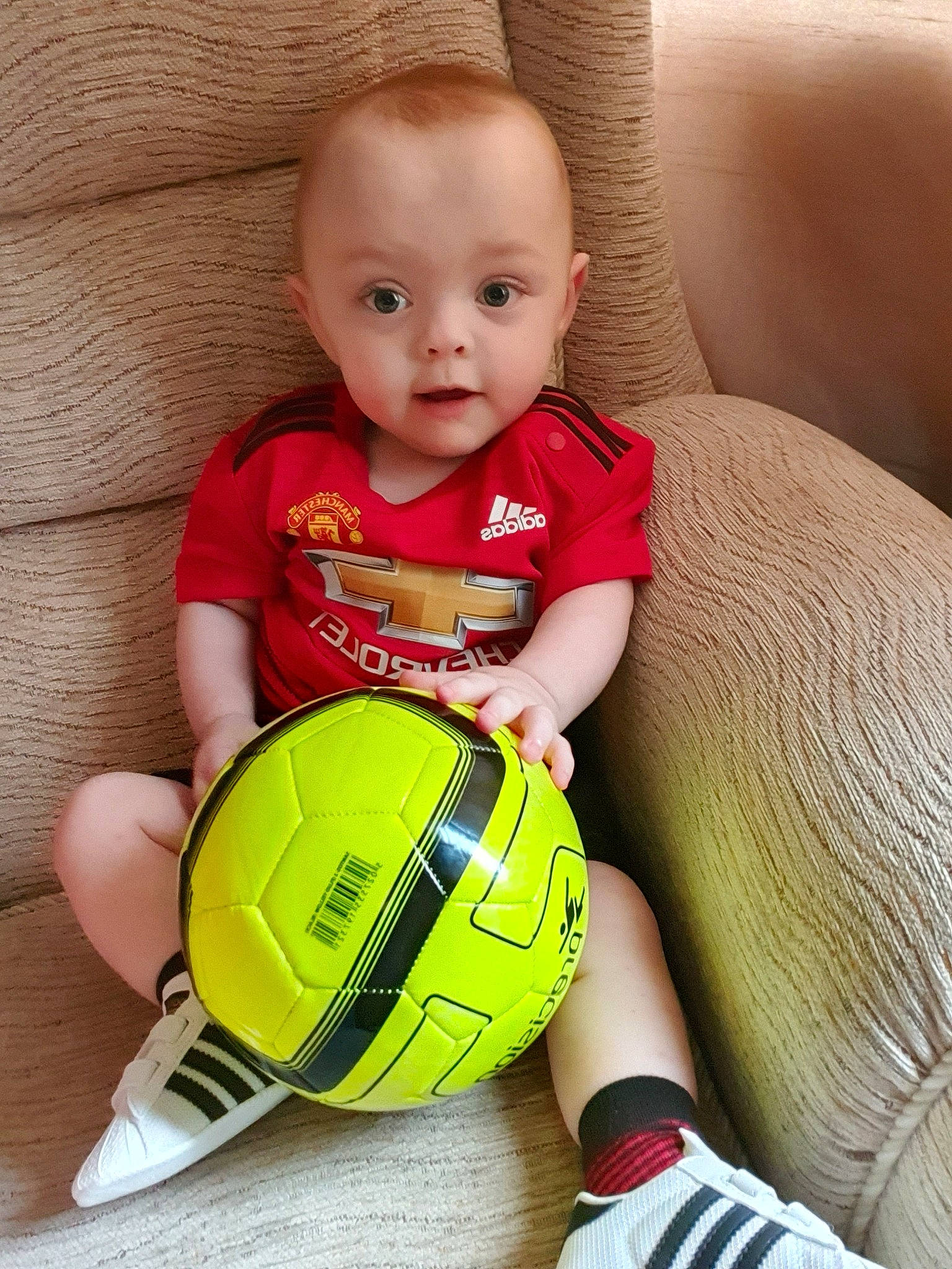 Graham is registered to the contest to win money with this photo: baby, ball, child, football, person, play, smile, soccer_ball, toddler, yellow