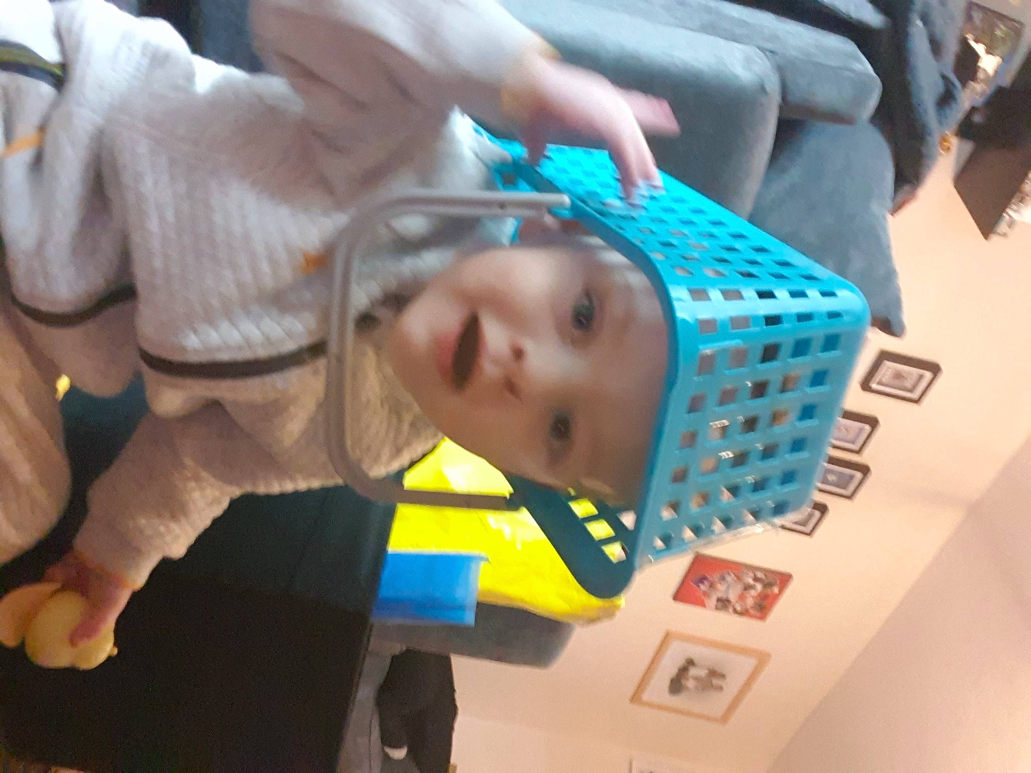Graham is registered to the contest to win money with this photo: arm, baby, baby_products, child, electric_blue, eyelash, eyewear, finger, fun, hand, headwear, mouth, nail, person, room, thumb, toddler, toy