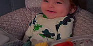 Zylus is registered to the contest to win money with this photo: baby, smiling, infant, cushion, seat, blanket, soft_toys, clothing, indoors, cozy, child, cute, happy, face, person, comfort, pattern, green, yellow, red