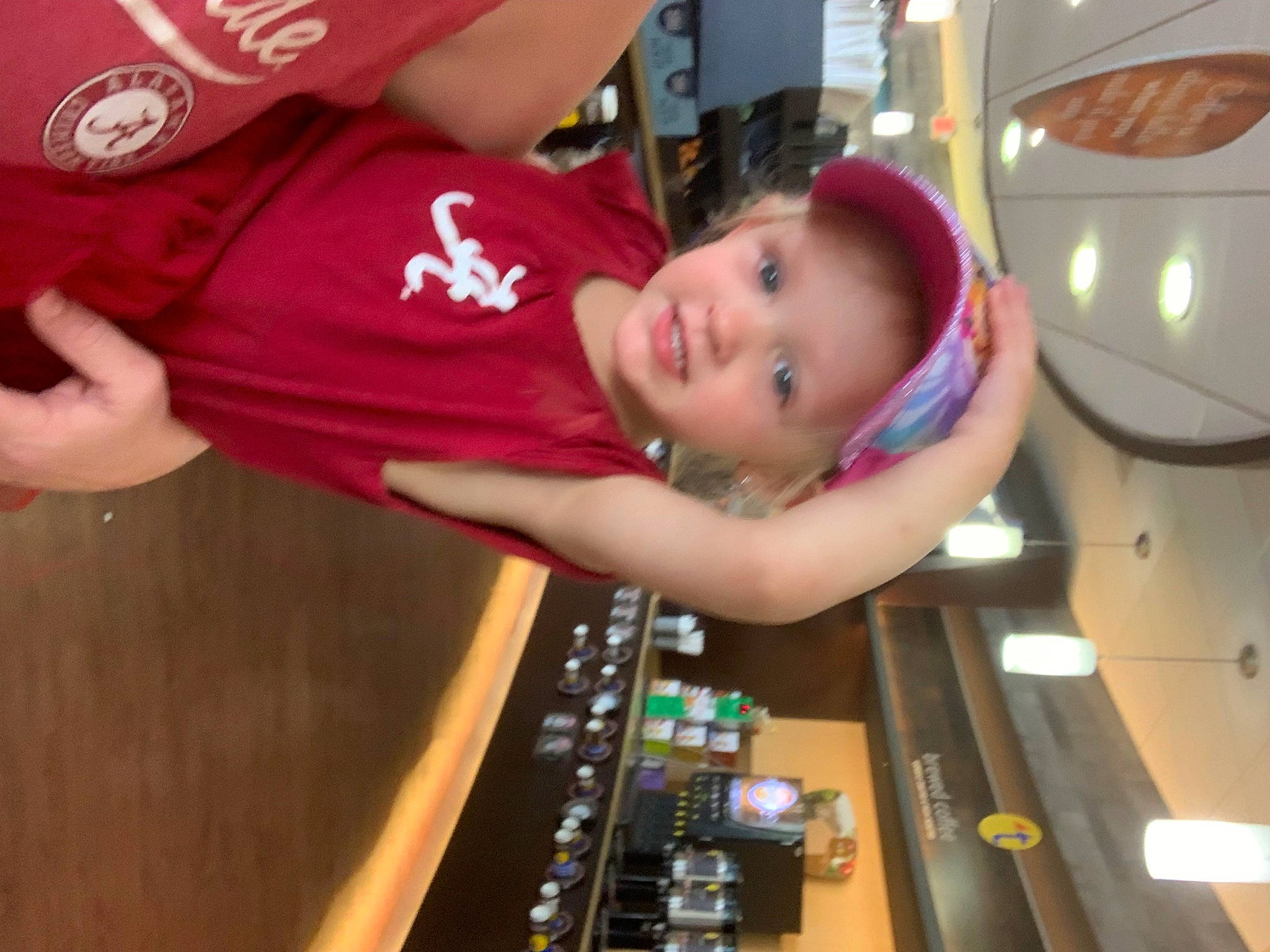 Maggie joined the competition — help win amazing prizes! audio_equipment, baby, baseball_cap, child, elbow, finger, fun, hand, headwear, leisure, machine, person, play, room, t_shirt, thumb, toddler, wood
