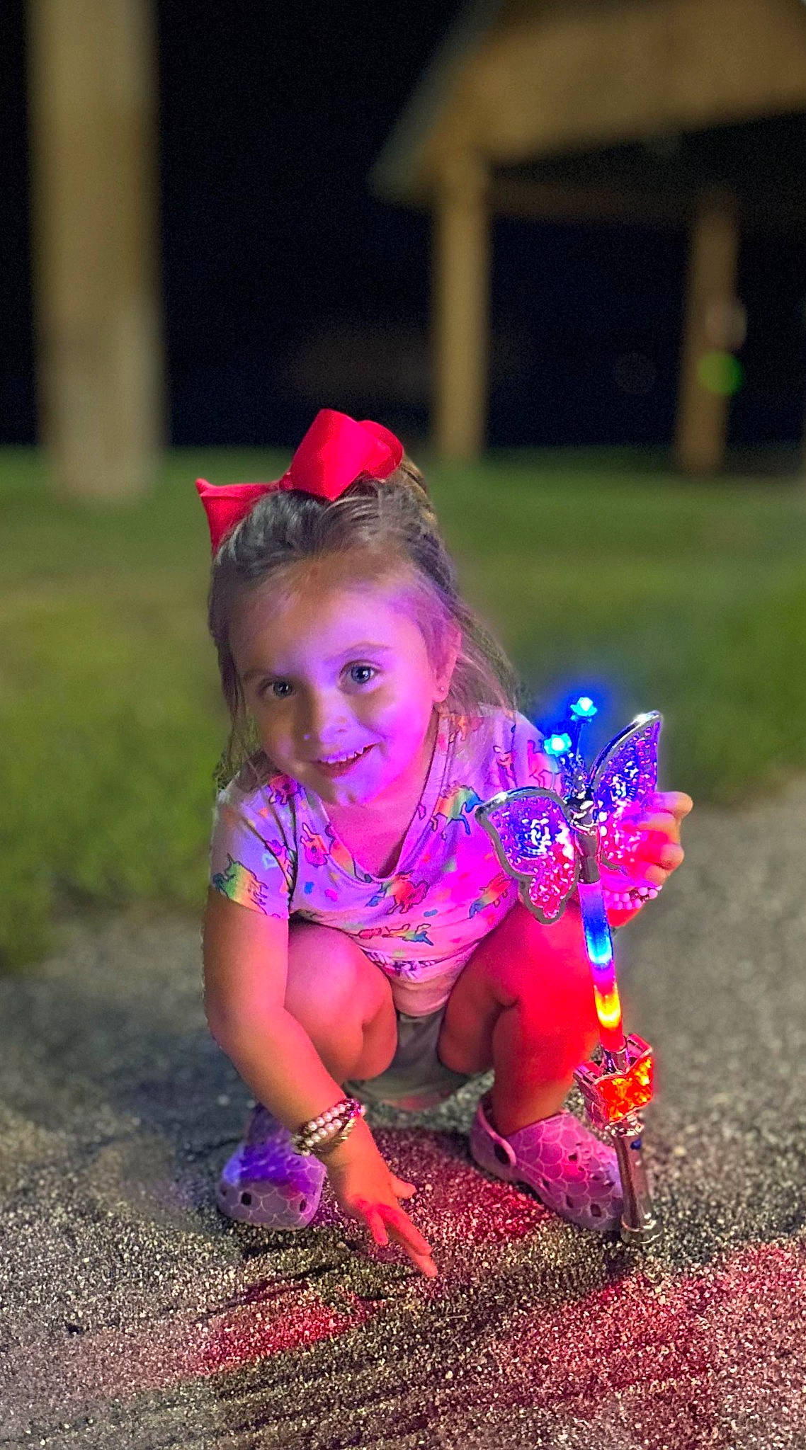 Jasmyn is registered to the contest to win money with this photo: child, electric_blue, fashion_accessory, flash_photography, fun, grass, hair_accessory, happy, joy, leisure, magenta, people_in_nature, person, petal, pink, plant, purple, recreation, smile, soil