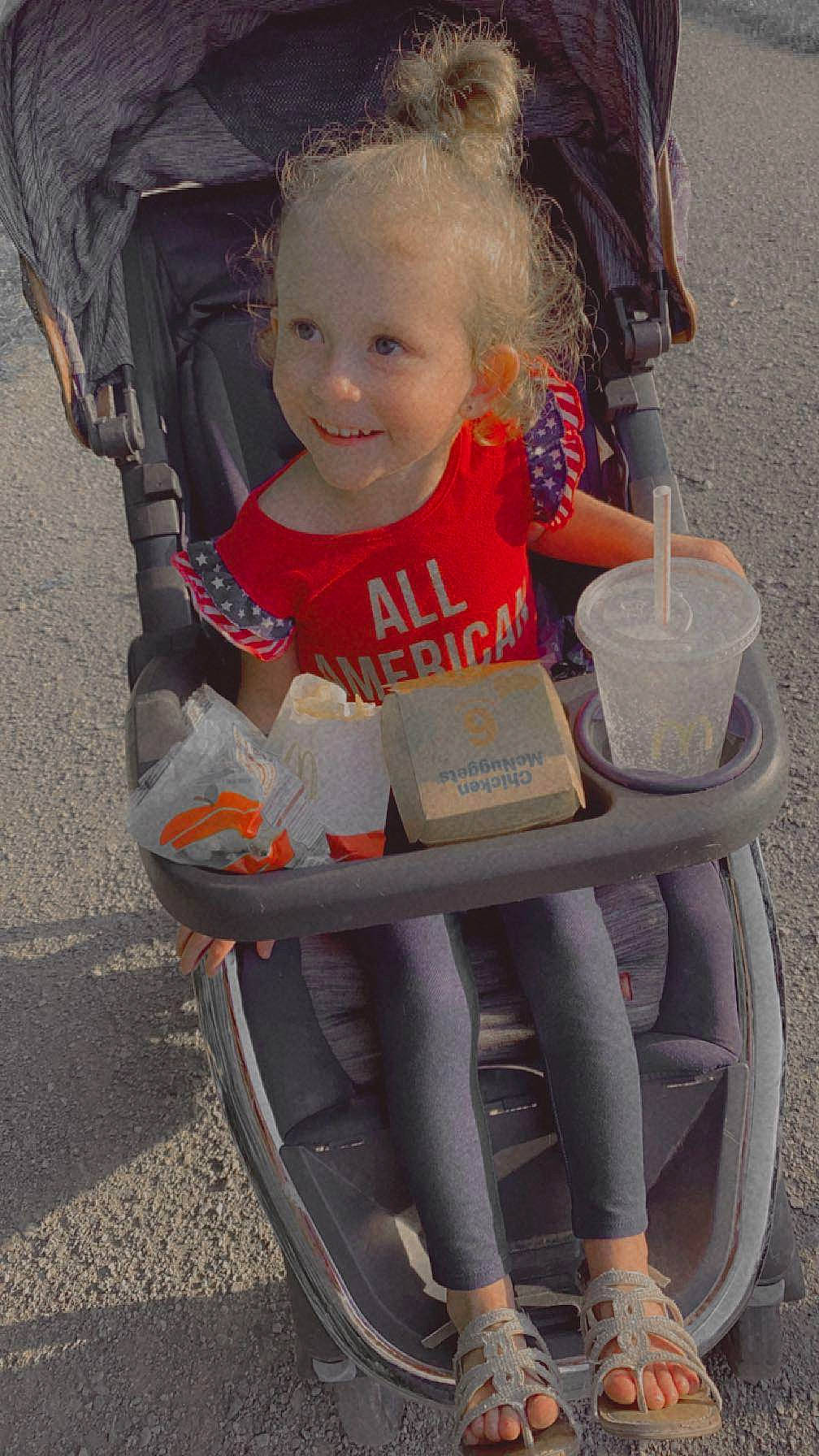 Raquel is registered to the contest to win money with this photo: automotive_tire, baby, baby_carriage, baby_products, baby_toddler_clothing, cart, chair, child, comfort, eye, fun, happy, joy, person, sandal, sitting, skin, smile, tire, toddler