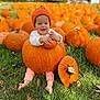 baby, infant, toddler, pumpkin, pumpkin_patch, orange, grass, hat, smiling, cute, autumn, fall, outdoors, field, leaves, legs, barefoot, sitting, happy, portrait