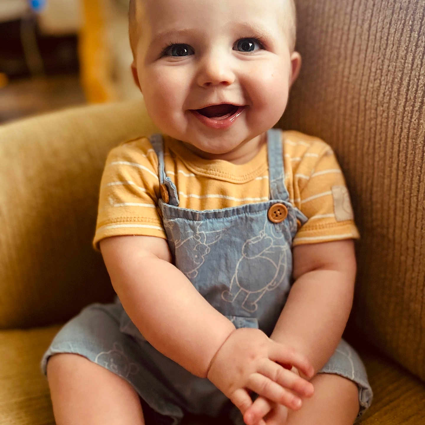 Oran joined the competition — help win amazing prizes! baby, babylaughing, bodypart, chair, clothing, couch, face, finger, furniture, hand, happy, head, jeans, laughing, pants, person, photography, portrait, sitting, smile