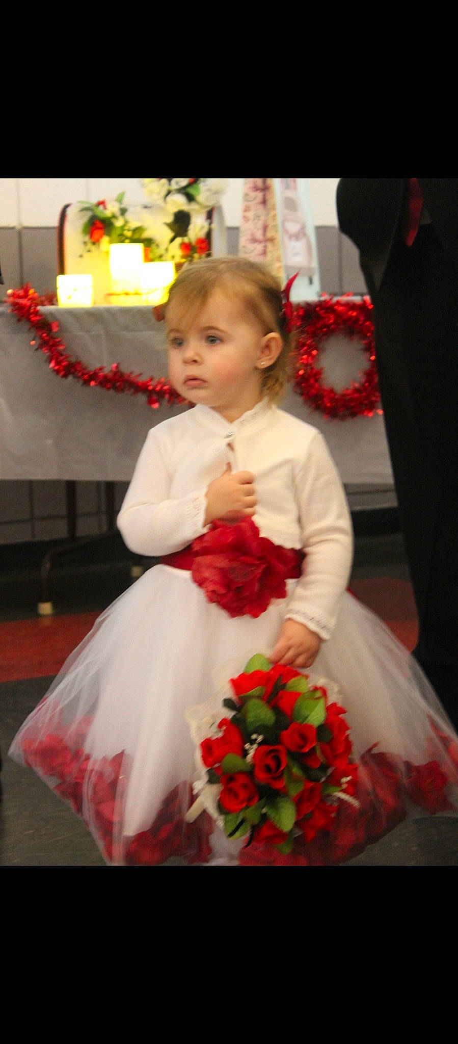 Bella is registered to the contest to win money with this photo: child, dress, event, flower, flower_arranging, formal_wear, fun, gown, hair, happy, head, person, petal, pink, plant, red, rose, toddler, tradition, wedding_ceremony_supply