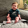 Ariel joined the competition — help win amazing prizes! baby, blanket, child, clothing, couch, curtains, face, furniture, happy, home, indoor, infant, jersey, person, plant, pot, sitting, smiling, sportswear, window