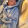 baby, blanket, blue, child, face, hood, infant, quilt, soft, swaddle, toddler, wrapped, young_child, indoor, cute, sleepwear, warm, resting, newborn, comfort