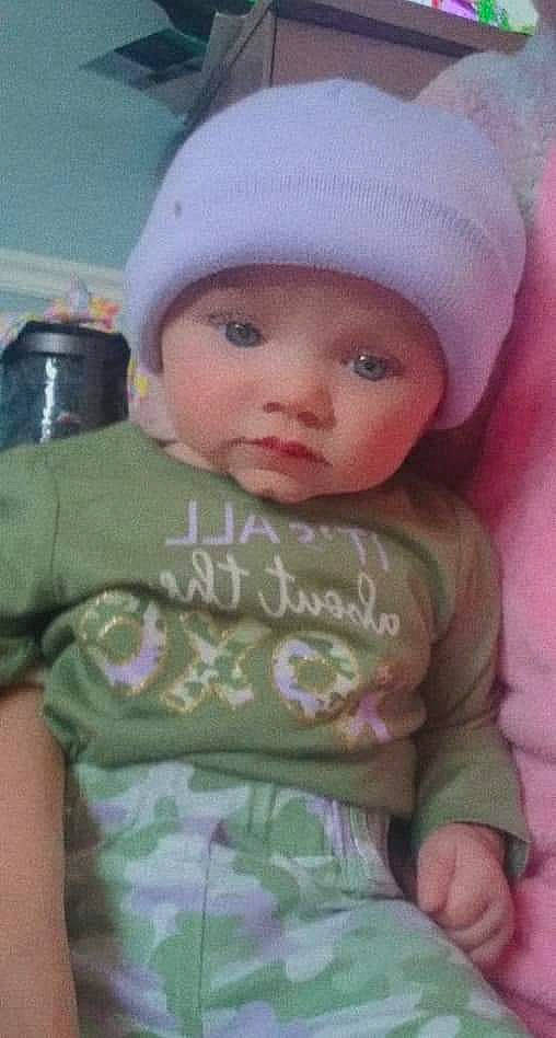 Ellis is registered to the contest to win money with this photo: baby, baby_toddler_clothing, cap, cheek, child, chin, face, happy, head, headgear, headwear, knit_cap, lip, nose, outerwear, person, pink, product, skin, sleeve