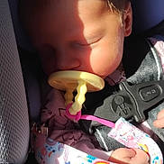Violet joined the competition — help win amazing prizes! baby, car_seat, child, closeup, clothing, colorful, cute, fabric, hand, infant, pacifier, peaceful, pink, rainbow, seatbelt, shadow, sleeping, star, strap, sunlight