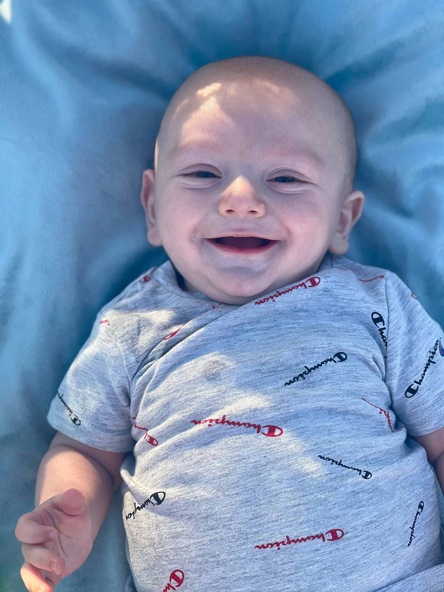 Bentlee is registered to the contest to win money with this photo: azure, baby, baby_toddler_clothing, cheek, chin, cool, eye, face, gesture, happy, head, iris, joy, lip, mouth, nose, person, purple, skin, sleeve