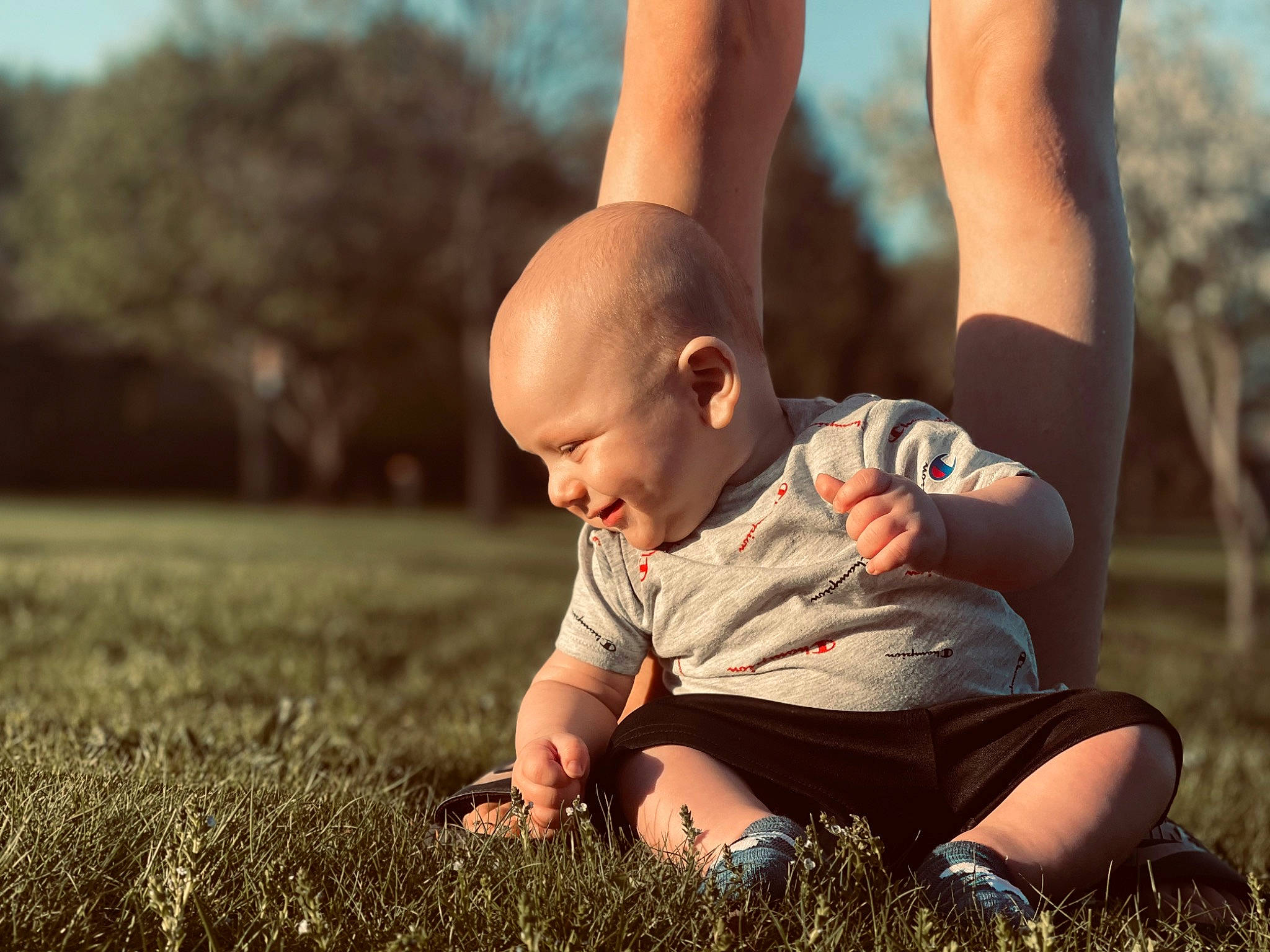 Bentlee joined the competition — help win amazing prizes! baby, child, finger, flash_photography, fun, gesture, grass, grassland, happy, interaction, landscape, lawn, leisure, meadow, people_in_nature, person, playing_with_kids, shoe, standing, sunlight