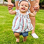 toddler, child, baby, grass, outdoor, walking, holding_hands, adult, tattoo, shorts, headband, striped_dress, barefoot, nails, person, summer, smile, happy, learning_to_walk, family
