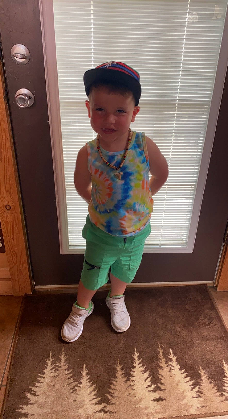 Blake is registered to the contest to win money with this photo: baby_toddler_clothing, baseball_cap, cabinetry, finger, floor, flooring, hand, human_body, joint, knee, leg, person, pink, product, shoe, sleeve, standing, thigh, toddler, white