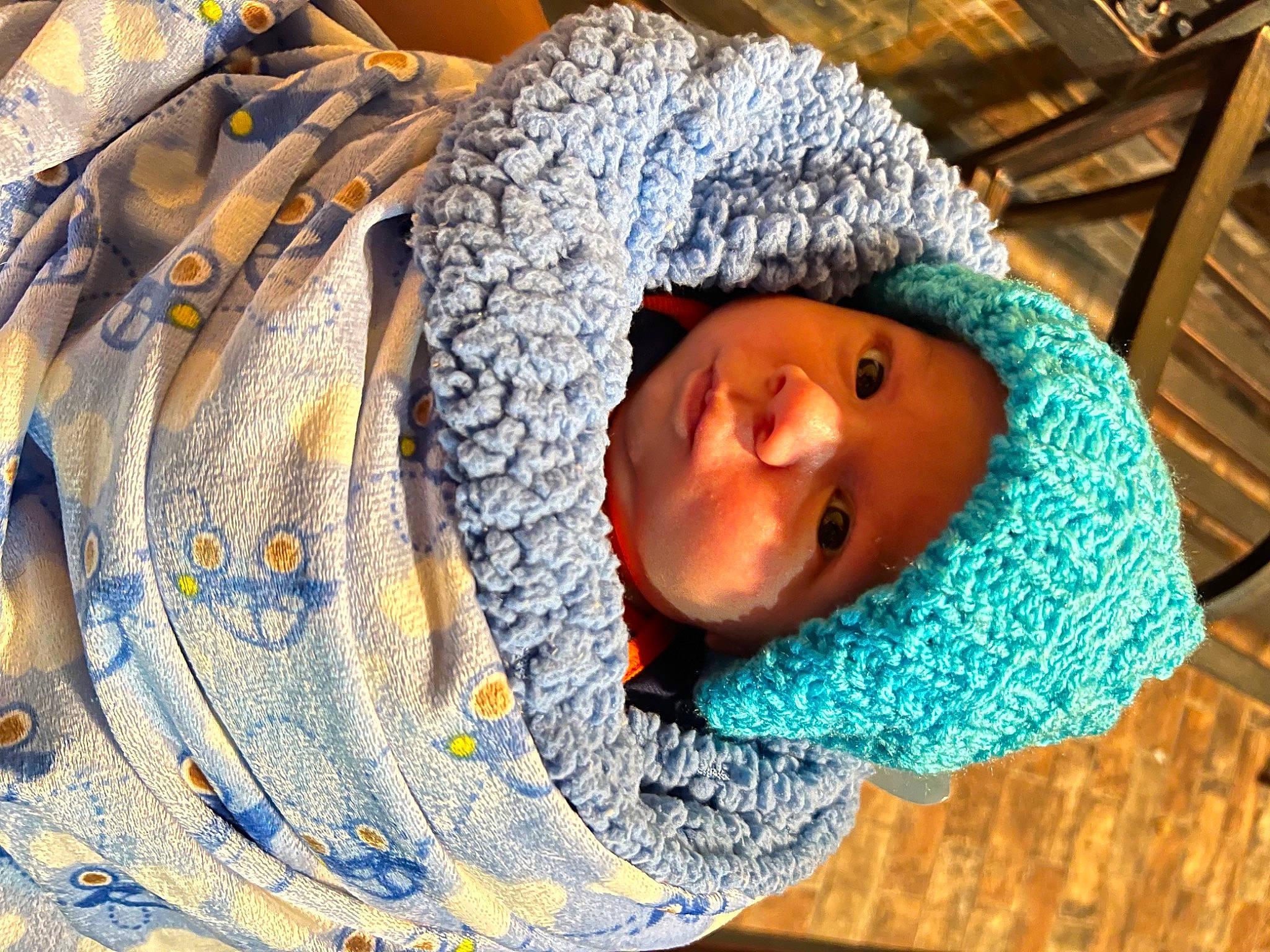 Adrian is registered to the contest to win money with this photo: azure, child, electric_blue, eye, fashion_accessory, freezing, fun, headgear, headwear, knit_cap, leisure, linens, outerwear, pattern, person, textile, toddler, tree, winter, wood