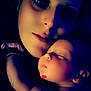 Mya is registered to the contest to win money with this photo: baby, woman, face, sleeping, embrace, love, intimate, portrait, closeup, skin, dark_background, peaceful, affection, head, arm, hand, eyelashes, soft_light, expression, tender