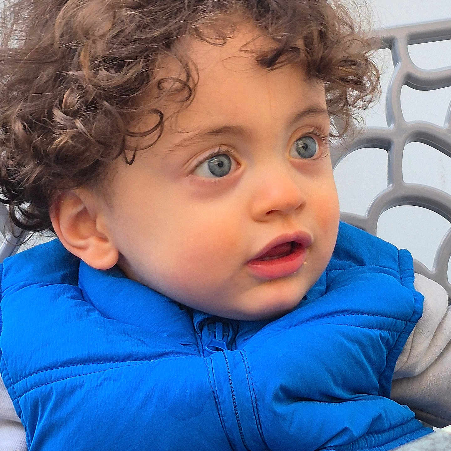 Damyan participe au concours pour gagner de l'argent avec cette photo : baby, bodypart, clothing, coat, face, finger, hair, hand, happy, head, hood, jacket, knitwear, pants, person, photography, portrait, smile, sweater, sweatshirt