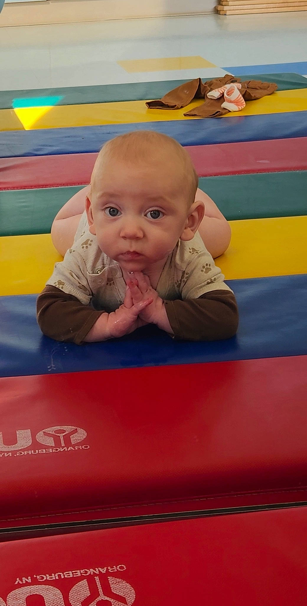 Greyson is registered to the contest to win money with this photo: baby, baby_toddler_clothing, cheek, child, crawling, electric_blue, eye, face, flooring, fun, happy, head, leisure, orange, person, play, playground, recreation, sitting, surprise