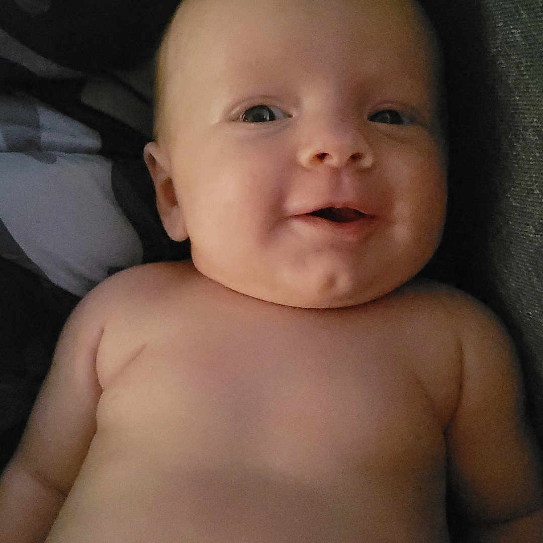 Iris joined the competition — help win amazing prizes! baby, child, chubby, closeup, cute, diaper, expression, face, head, human, indoors, infant, lying_down, newborn, person, portrait, skin, smile, soft_lighting, torso