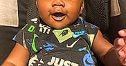 Keyon joined the competition — help win amazing prizes! baby, infant, child, portrait, smiling, happy, stroller, seated, black_clothing, nike, patterned_outfit, fashion, close_up, face, eyes, mouth, indoor, casual, adorable, photography