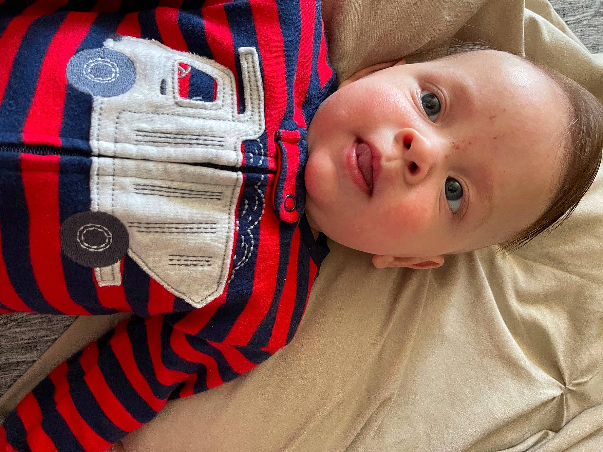 Isaiah joined the competition — help win amazing prizes! baby, baby_toddler_clothing, cheek, child, collar, comfort, elbow, eyelash, hat, headgear, nose, pattern, person, plaid, red, skin, sleeve, tartan, toddler, wood