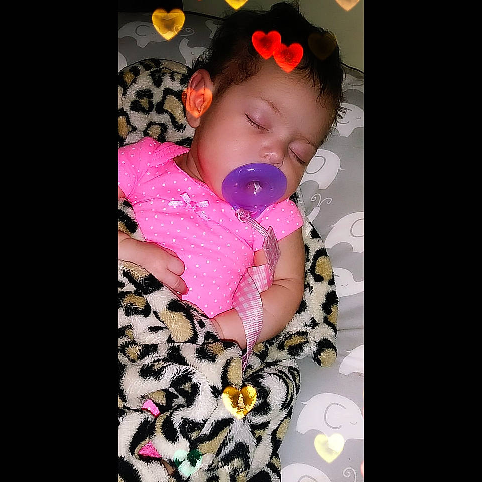 Alaysia is registered to the contest to win money with this photo: baby, baby_toddler_clothing, beauty, cheek, child, cool, ear, eye, hair_accessory, head, lip, mouth, nose, person, petal, photography, pink, product, skin, smile