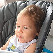 Ethan a rejoint le concours — aidez-le/la à gagner de superbes lots ! baby, child, curious_expression, face, frog_graphic, furniture, hair, high_chair, indoor, natural_light, person, plastic_tray, portrait, seat, sitting, skin, toddler, white_tank_top, window, young_child