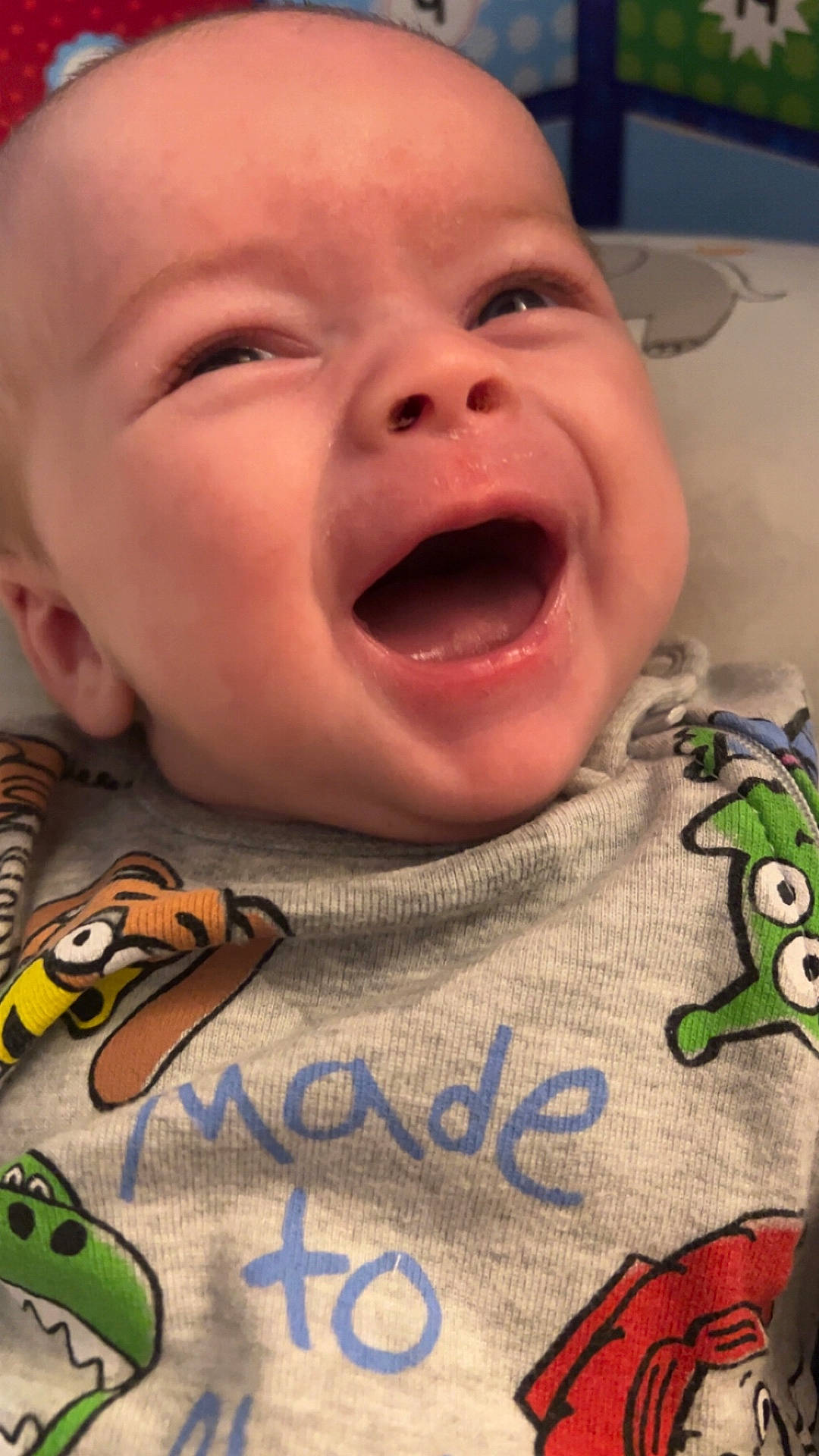 Kepler is registered to the contest to win money with this photo: baby, babylaughing, bodypart, face, finger, hand, happy, head, laughing, mouth, newborn, person, photography, portrait, quilt