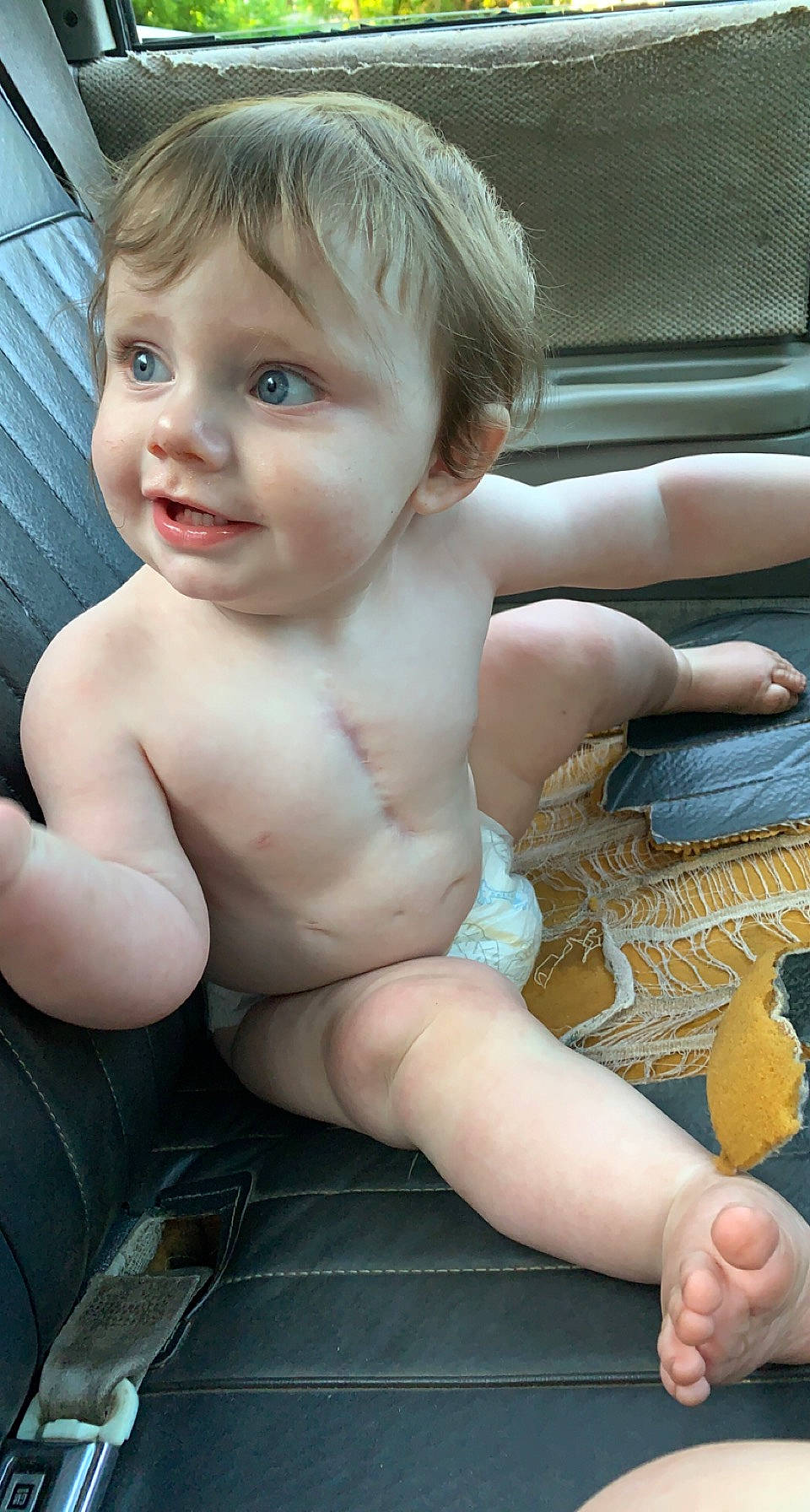 Kasen joined the competition — help win amazing prizes! barechested, blond, cheek, chest, child, chin, eye, eyelash, finger, hair, head, human_leg, iris, person, sitting, skin, smile, thigh, thumb, toddler