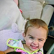 Kenzleigh joined the competition — help win amazing prizes! baby, blanket, child, clothing, couch, cozy, cute, expression, face, furniture, grin, happy, head, home, indoor, person, playful, smile, soft_toy, toddler