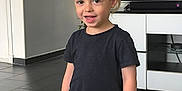 Lissandro a rejoint le concours — aidez-le/la à gagner de superbes lots ! black_tshirt, blue_jeans, cabinet, casual_clothing, child, cute, floor, furniture, hair, happy, home, indoor, living_room, person, posing, smiling, standing, television, toddler, young