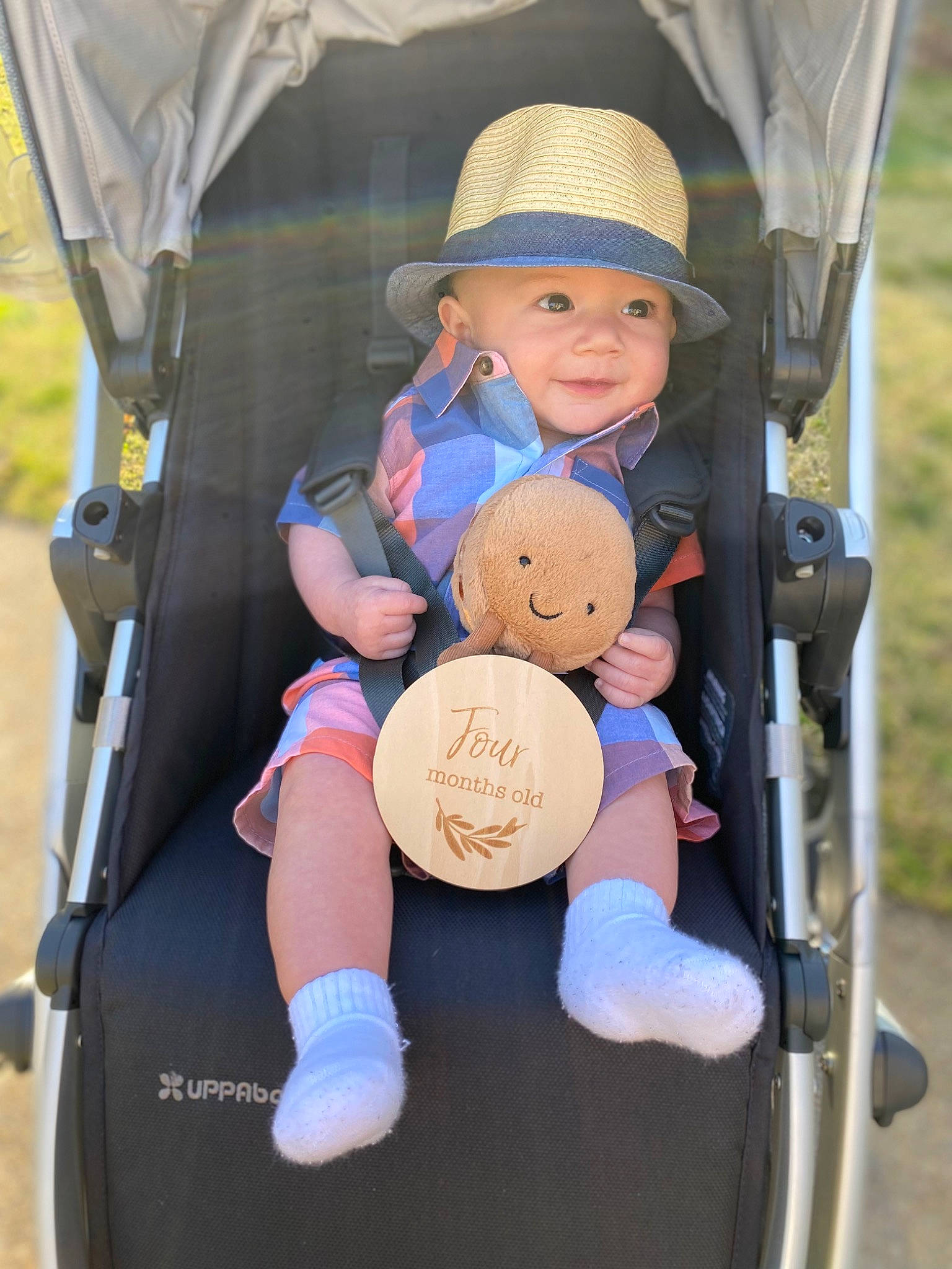 Bryce joined the competition — help win amazing prizes! baby, baby_carriage, baby_products, baby_toddler_clothing, chair, child, fashion_accessory, folding_chair, fun, hat, headwear, motor_vehicle, person, recreation, sitting, smile, stuffed_toy, sun_hat, teddy_bear, toddler