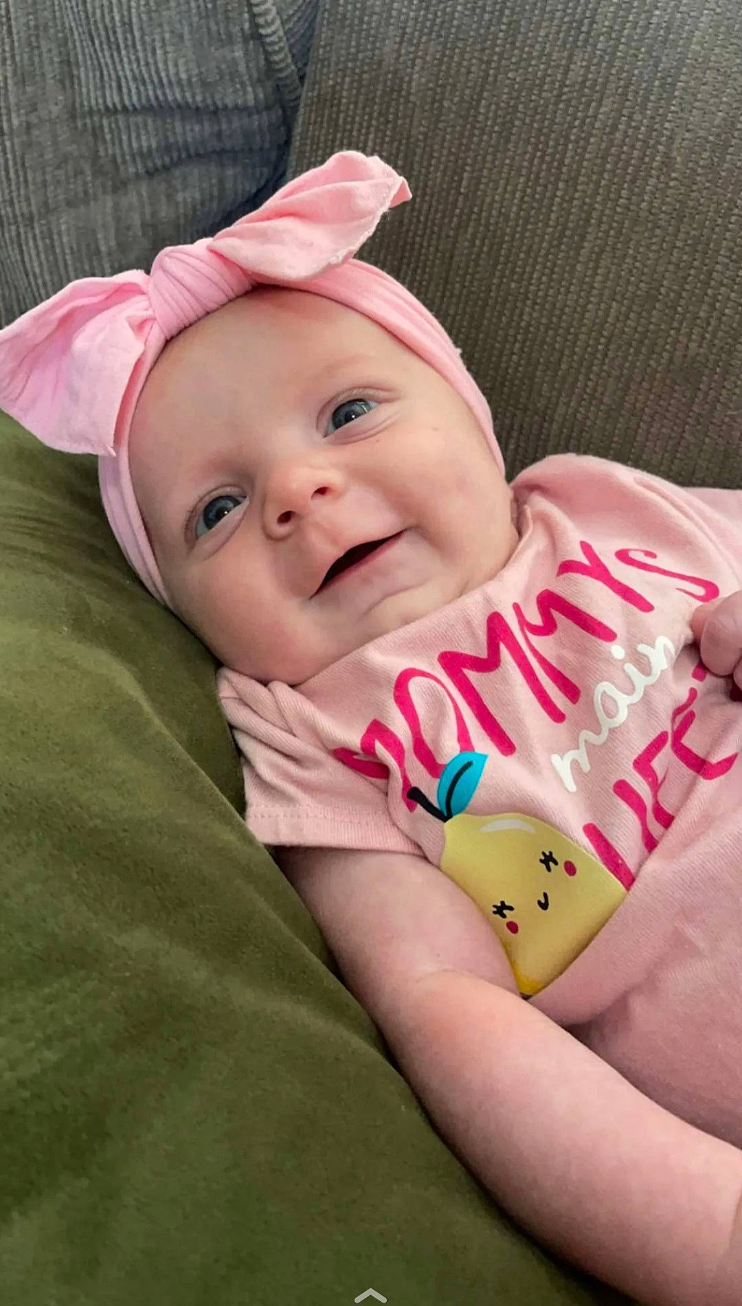 Ember is registered to the contest to win money with this photo: baby, baby_laughing, baby_toddler_clothing, cheek, child, comfort, dress, elbow, eye, finger, happy, hat, headwear, human_body, linens, lip, magenta, person, pink, skin