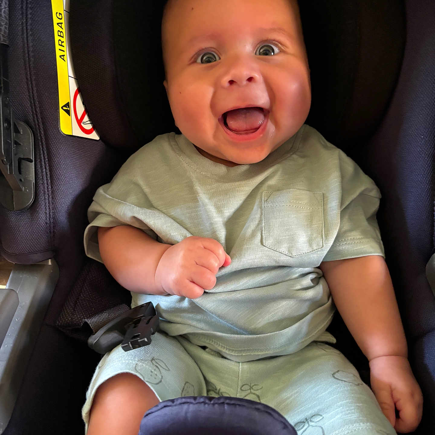Ollie is registered to the contest to win money with this photo: baby, baby_outfit, bright_eyes, car_seat, cheeks, child, clothing, cute, hands, happy, head_support, indoor, infant, joyful, person, portrait, safety, seat, seatbelt, smiling