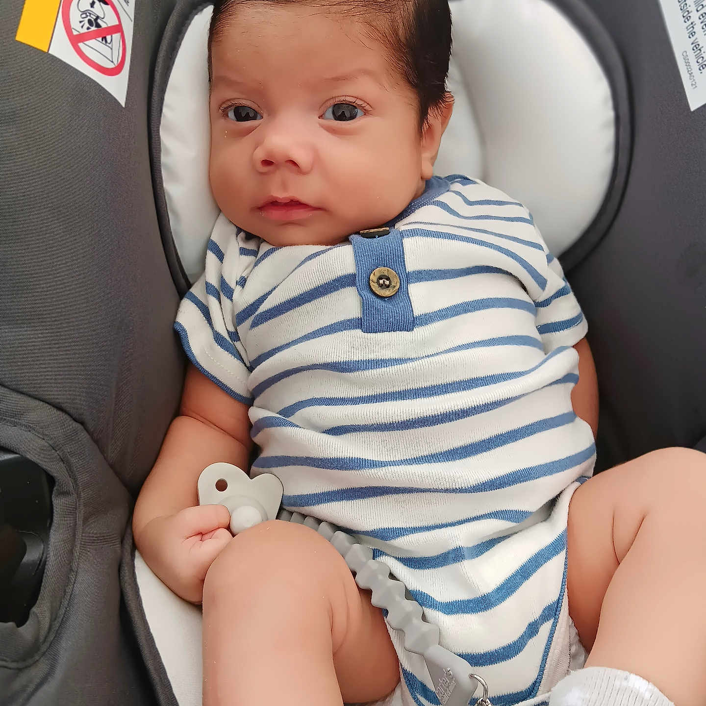 James is registered to the contest to win money with this photo: baby, bodypart, car, clothing, cushion, face, finger, footwear, hand, happy, head, homedecor, newborn, person, photography, portrait, sitting, smile, transportation, vehicle