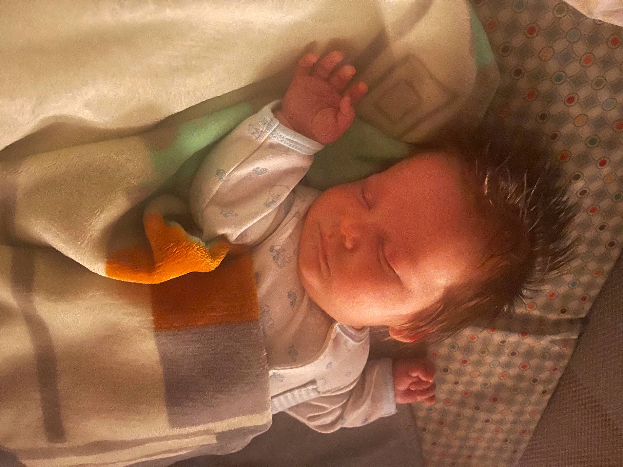 Lukas is registered to the contest to win money with this photo: baby, baby_sleeping, baby_toddler_clothing, bed, bedtime, cheek, child, comfort, ear, finger, head, human_body, linens, mouth, nose, orange, person, skin, sleeve, textile