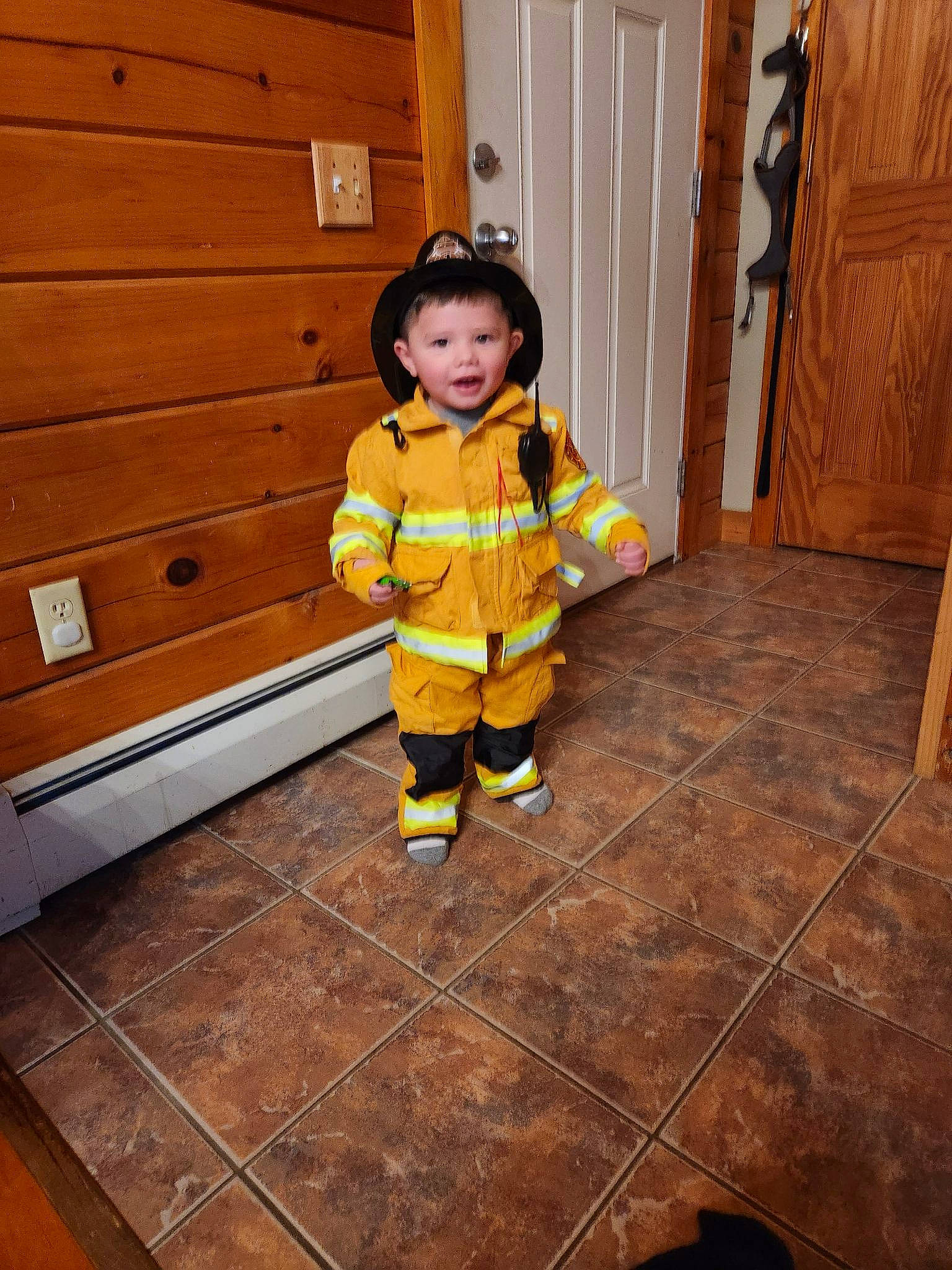 Jayce joined the competition — help win amazing prizes! baby_toddler_clothing, child, door, face, floor, flooring, hardwood, home_door, house, pattern, person, personal_protective_equipment, road_surface, room, sleeve, stairs, toddler, varnish, wood, wood_flooring