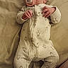 baby, infant, pacifier, onesie, sleepwear, bed, blanket, sleeping, newborn, cute, child, soft, comfort, lying_down, pajamas, peaceful, small_hands, footed_pajamas, resting, indoors