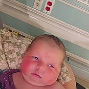 Rosanna joined the competition — help win amazing prizes! baby, infant, hospital, bed, blanket, pillow, face, rosy_cheeks, person, indoor, healthcare, patient, wall, electrical_outlet, resting, newborn, child, closeup, portrait, medical