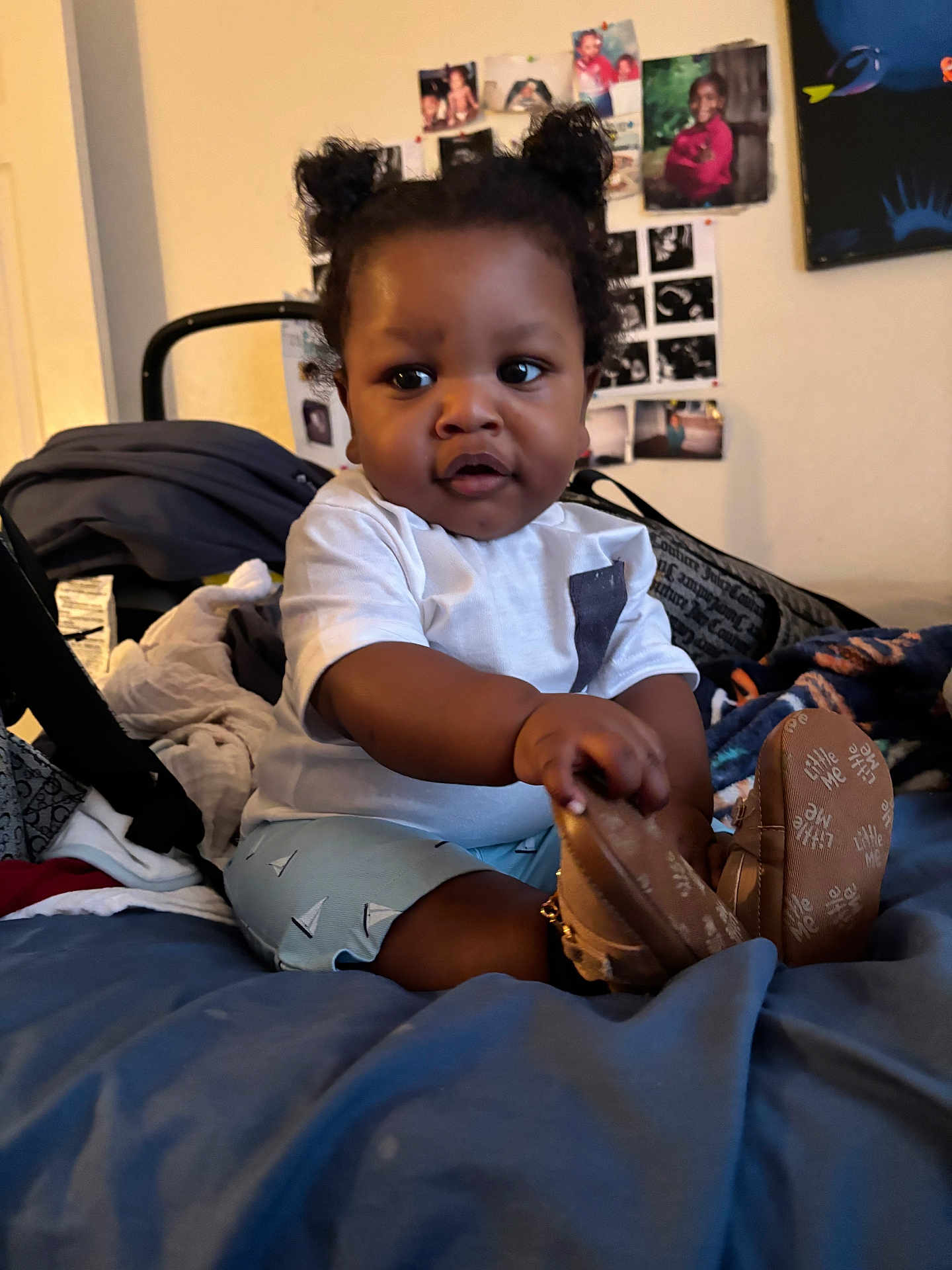 Marquele joined the competition — help win amazing prizes! baby, child, indoor, bed, blanket, clothing, footwear, person, portrait, hair, cute, infant, room, photography, furniture, wall_photos, expression, sitting, hand, shoe